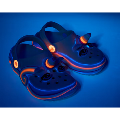 Glowing blue children's sandals with a unicorn design on a blue background